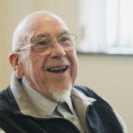 Smiling senior after All-on-4 dental implants in South Bend