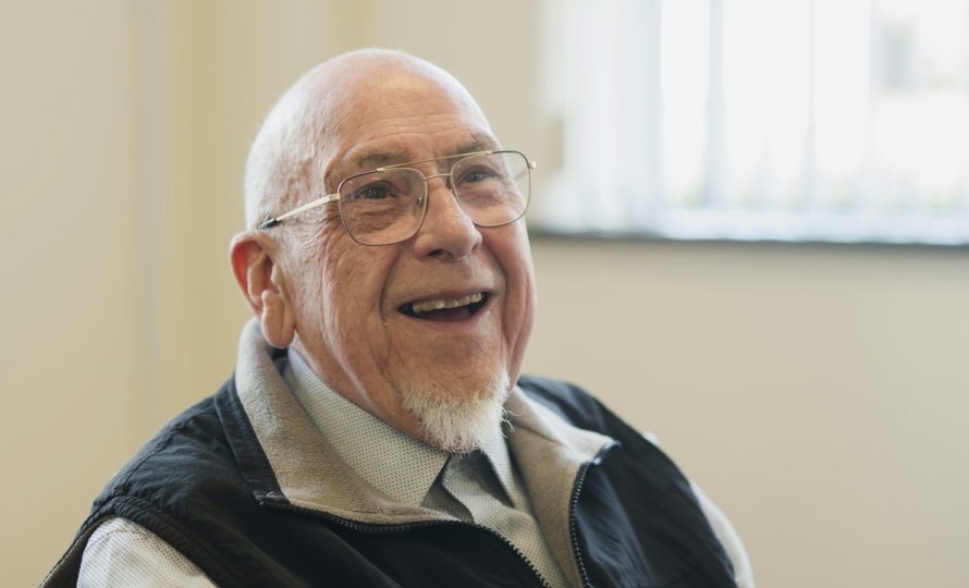 Smiling senior after All-on-4 dental implants in South Bend