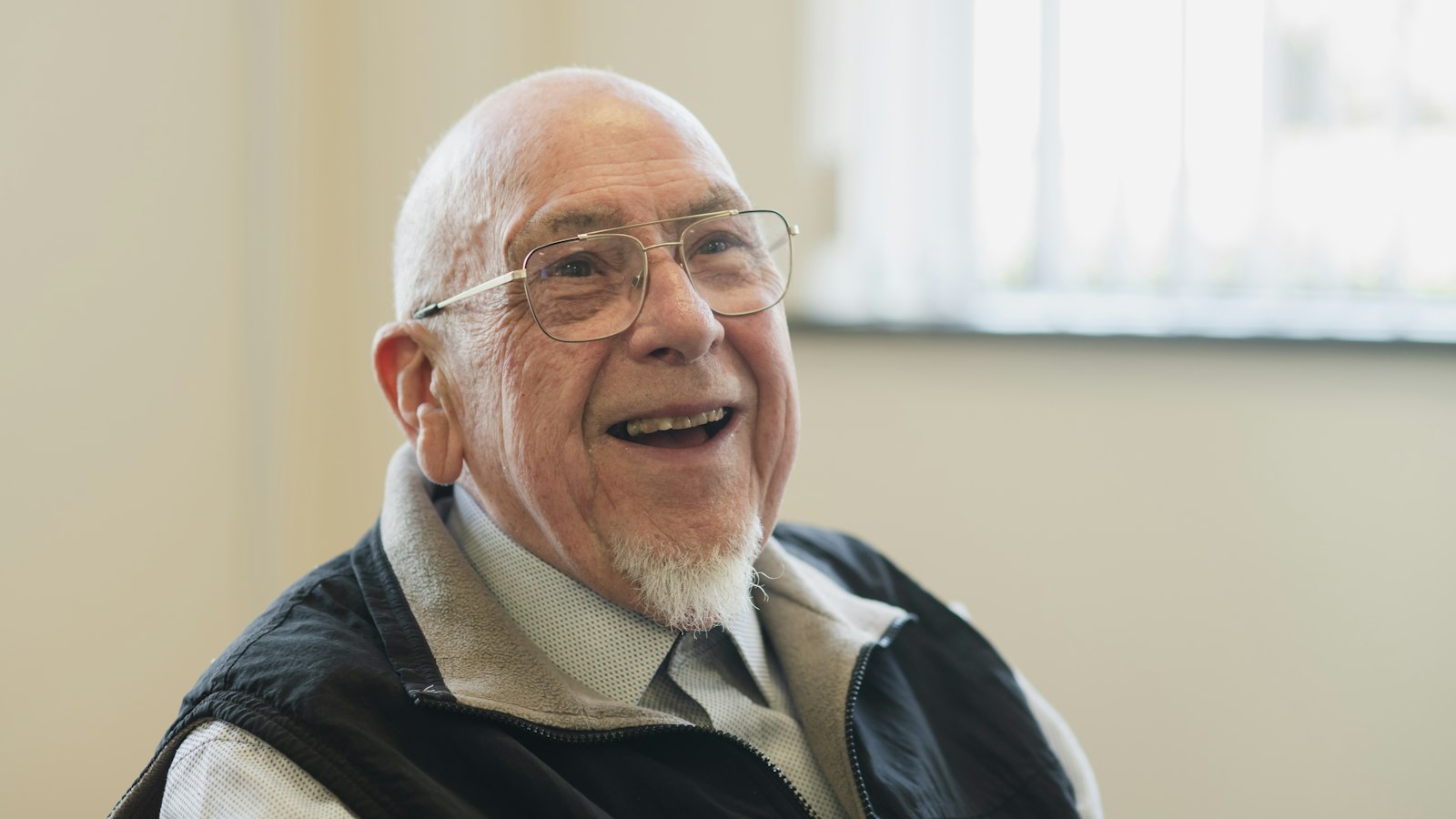 Smiling senior after All-on-4 dental implants in South Bend